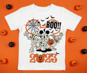 White womens cotton t-shirt halloween mockup with pumpkins on orange background. Design t shirt template, print presentation mock up. Top view flat lay.