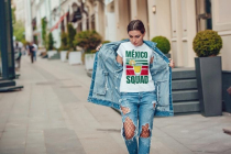 Attractive girl in a jeans jacket and white t-shirt walking along the street. Mock-up.