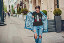 Attractive girl in a jeans jacket and white t-shirt walking along the street. Mock-up.