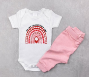 White baby girl bodysuit mockup flat lay with pink panties on the gray concrete background. Design onesie template, print presentation mock up. Top view.